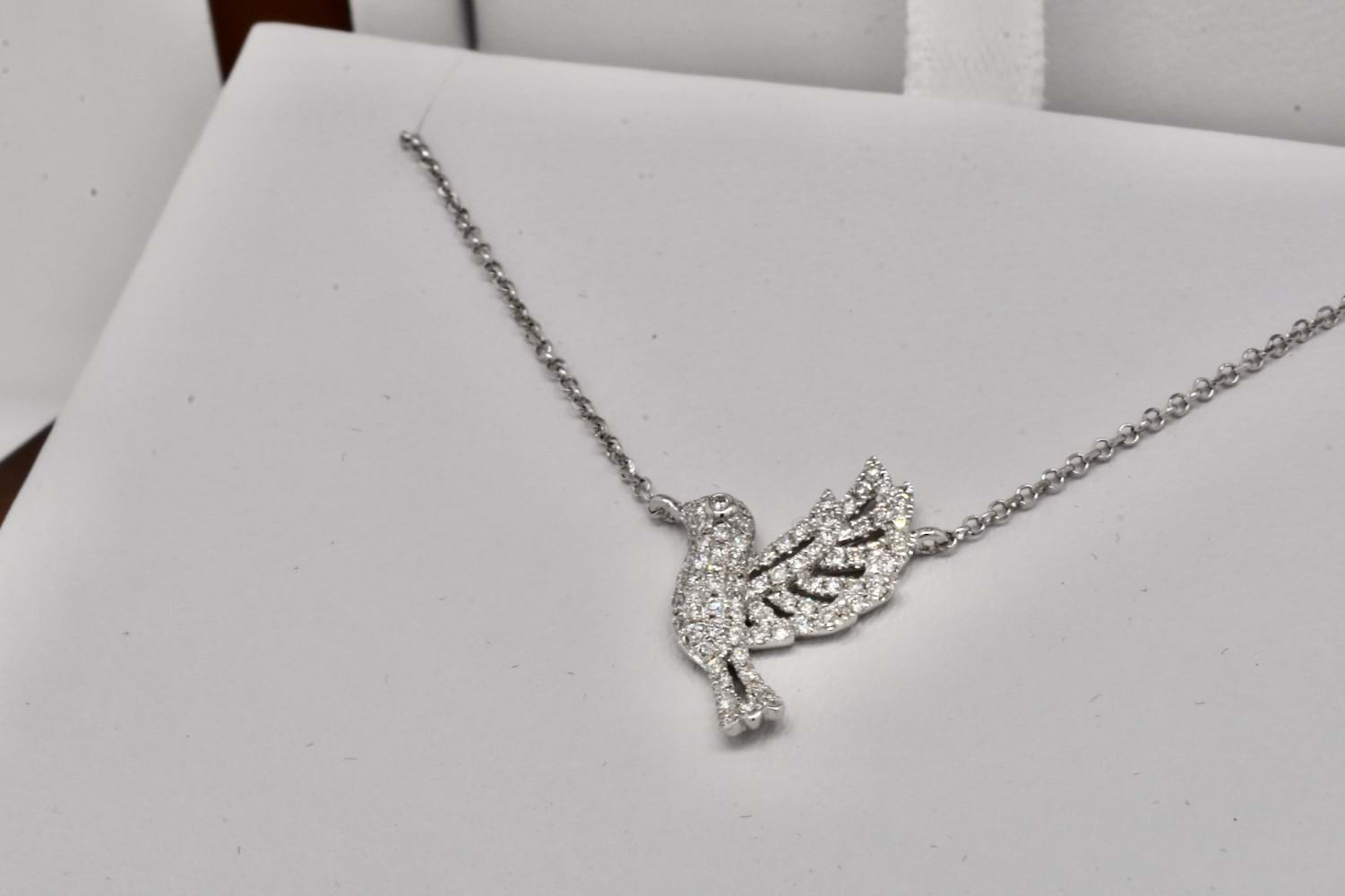 white gold bird pendant